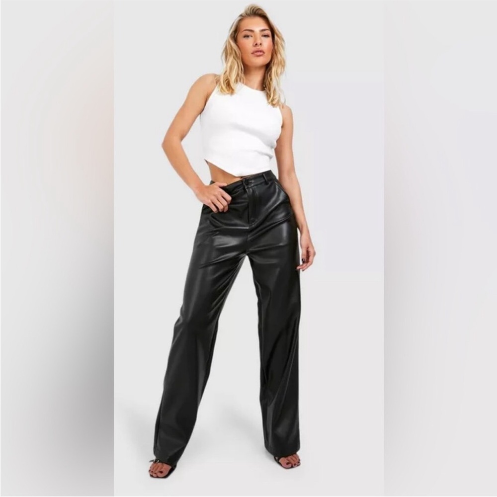 WAIST 17”.  rise 13”inseam 29” relaxed, fit straight leg, black faux leather.